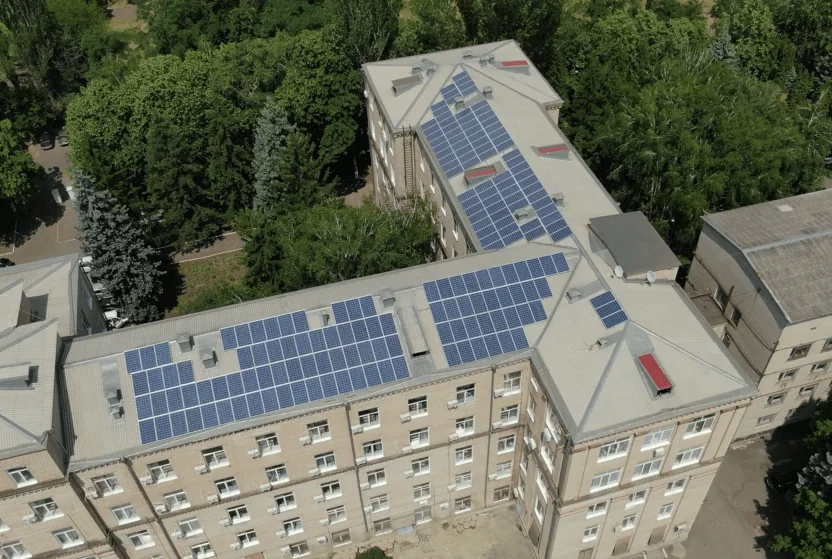 Editorial hero for “An ESCO Portfolio for Local Clean Energy”: infrastructure, people and the project’s core technical intervention, without implying that the project is complete.