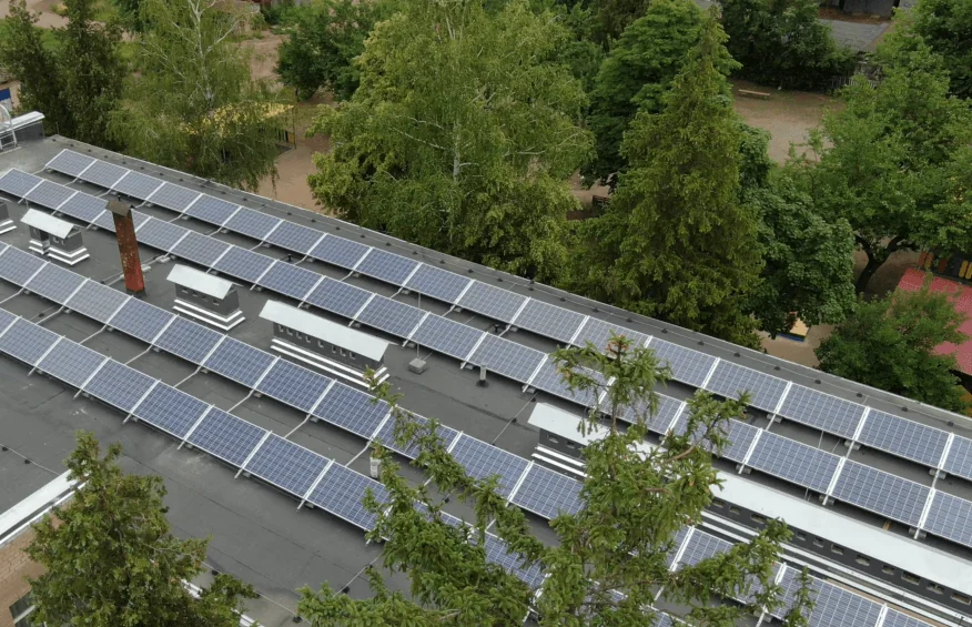 Editorial hero for “An ESCO Portfolio for Local Clean Energy”: infrastructure, people and the project’s core technical intervention, without implying that the project is complete.