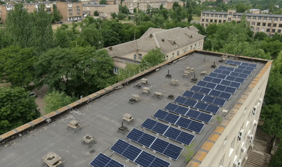 Editorial hero for “An ESCO Portfolio for Local Clean Energy”: infrastructure, people and the project’s core technical intervention, without implying that the project is complete.