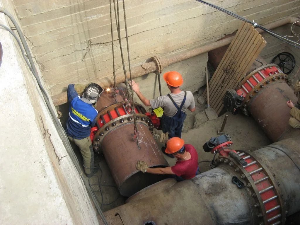 Editorial hero for “Adaptive Water Network for Pokrovskyi District”: infrastructure, people and the project’s core technical intervention, without implying that the project is complete.